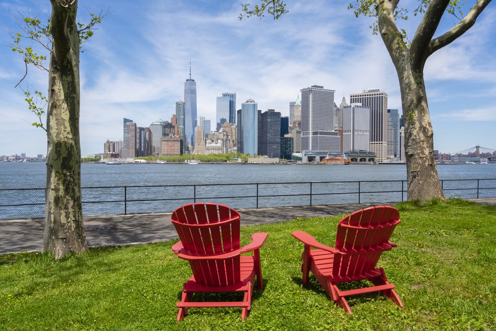 Chairs on Governors Island facing the skyline at Lower Manhattan in New York City