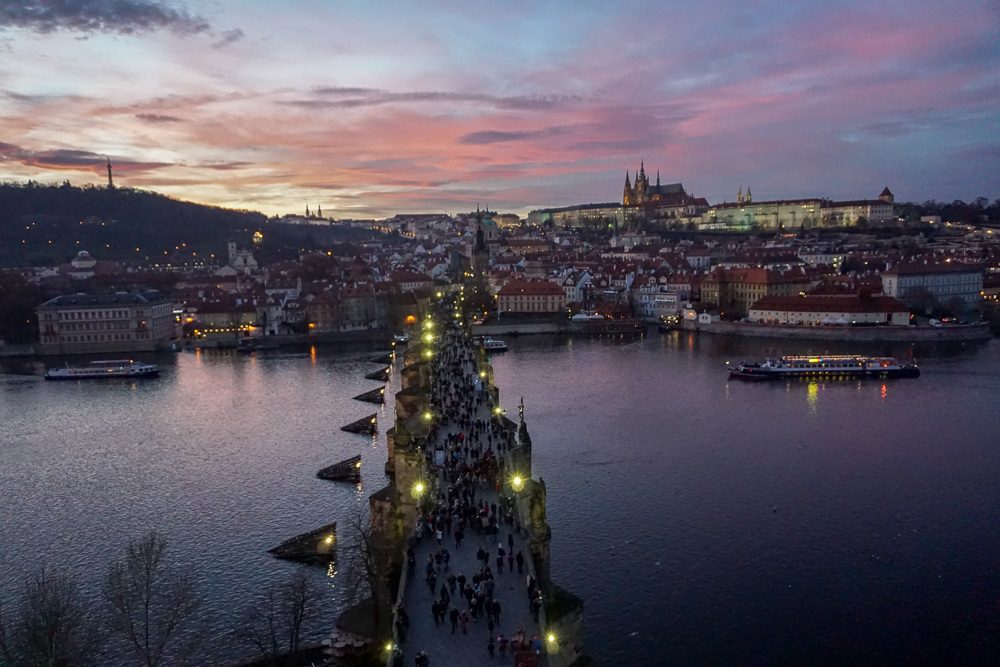 Prague View of the Charles Bridge from above at the last of sunset with a just a bit of pink in the darkening sky