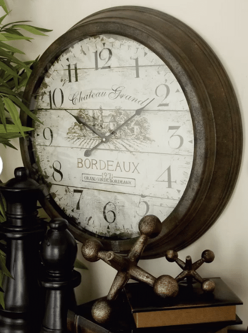 French country style wall clock hanging on a wall
