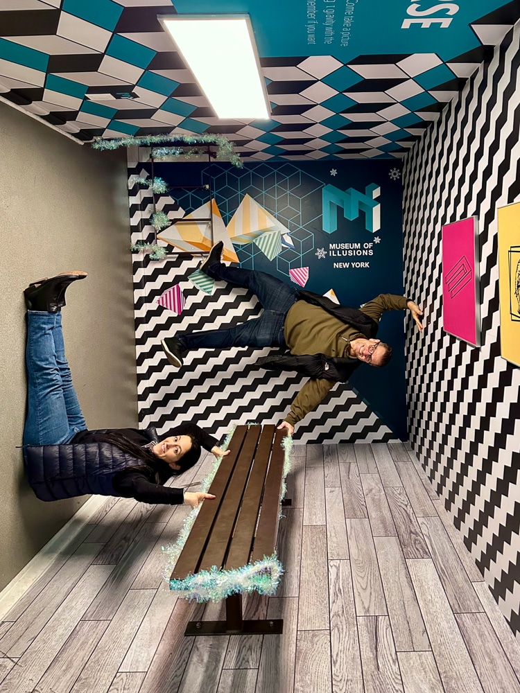 2 people "upside down" in the no gravity room at the museum of illusions in chelsea nyc