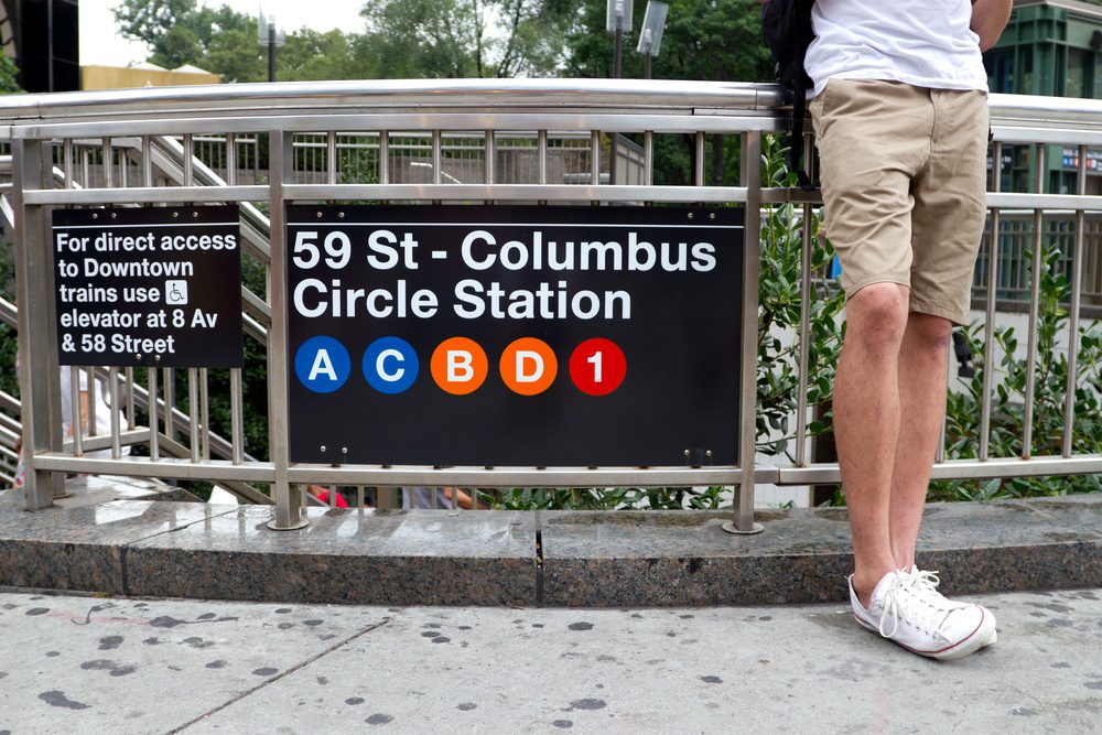 Man standing and waiting at the 59th street - Columbus Circle subway station, Manhattan, New York