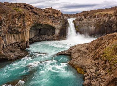View of Aldeyjarfoss waterfall among the rocks in Iceland