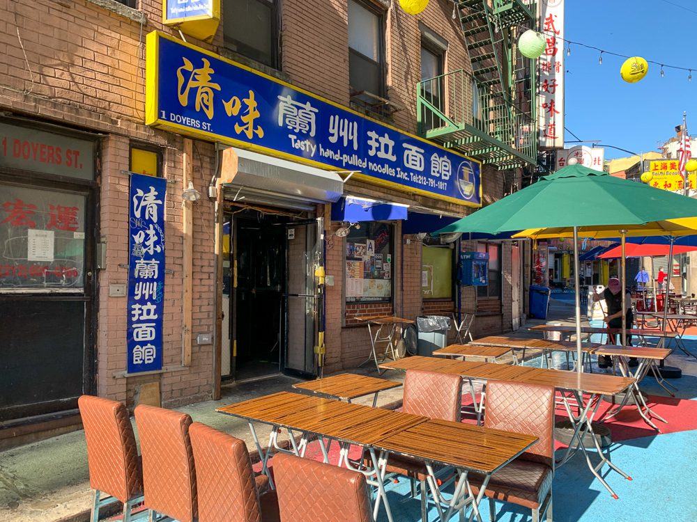 Tasty Hand Pulled Noodles storefront and outdoor seating on Doyers Street in Chinatown NYC