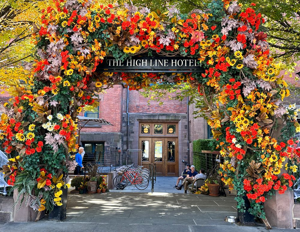 Chelsea NYC hotel entrance with a flower arch