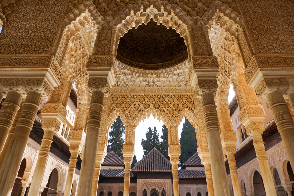 Alhambra in Granada Spain - detailed arches and pillars in one of the palaces