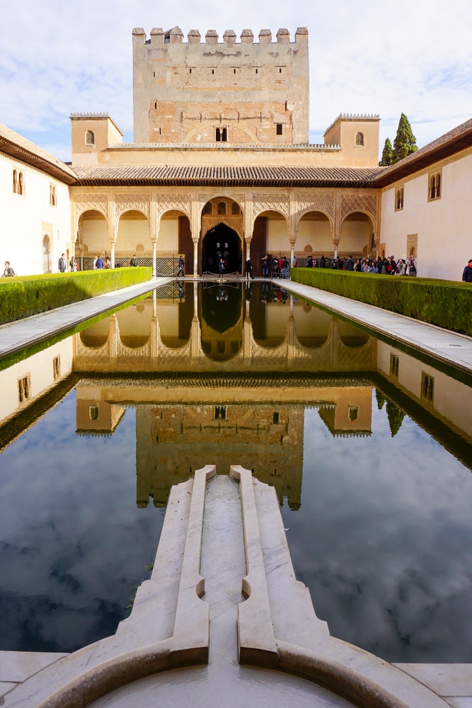 Alhambra in Granada Spain - a rectangular pool of water reflecting the palace in the background