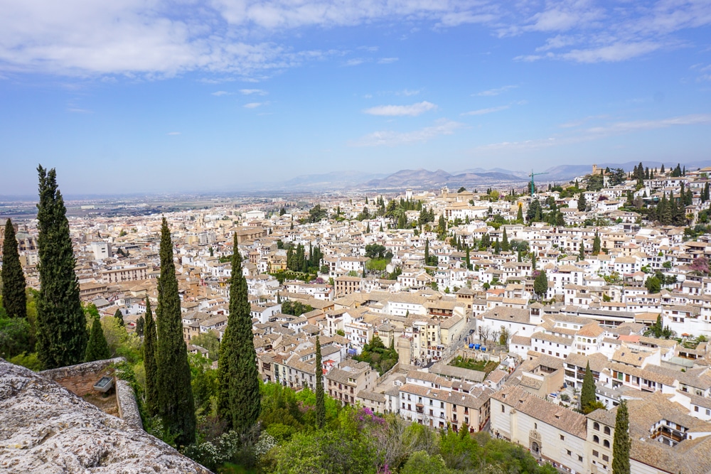 View from the Alhambra overlooking the white houses of Granada Spain