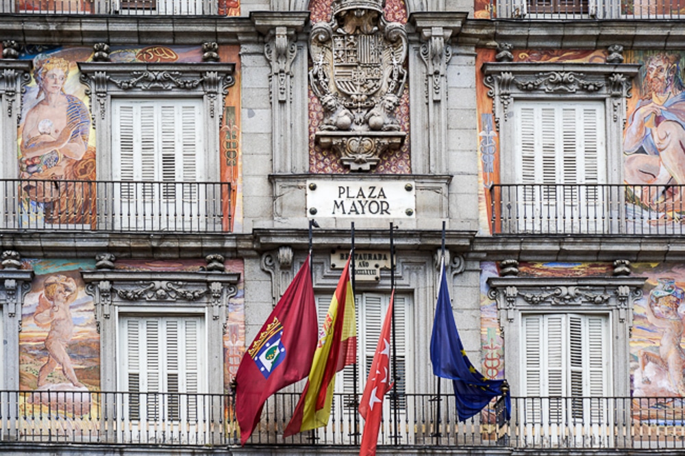 Close up of Plaza Mayor in Madrid Spain. Building has tromp l'oeil effect on the facade
