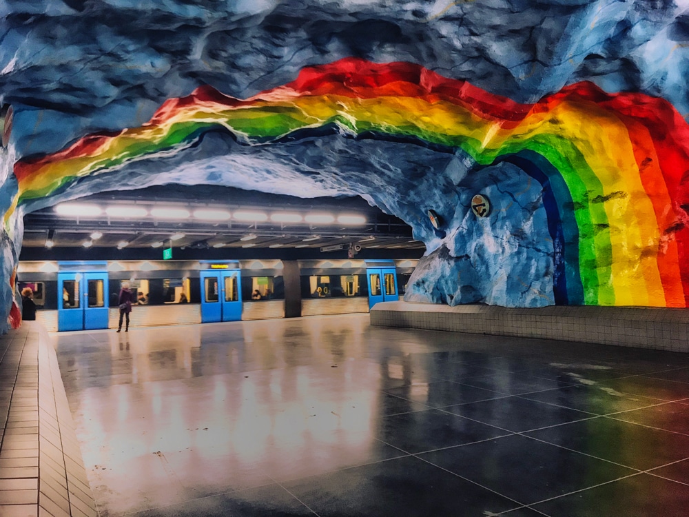 Stockholm subway station with rainbow painted on ceiling