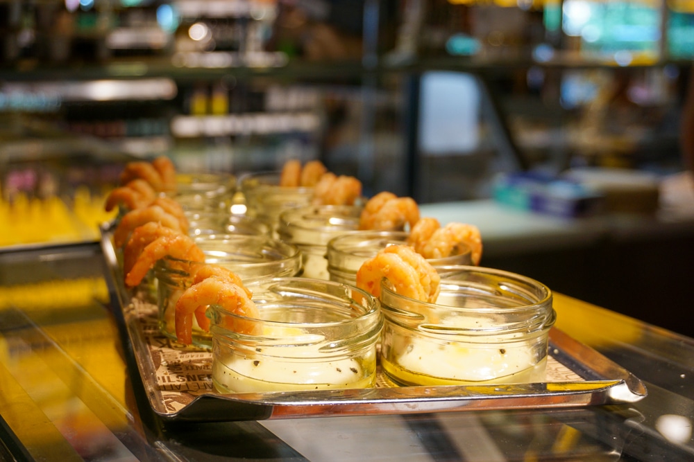 Shrimp appetizers with a white dip in individual glass dishes in Stockholm Sweden