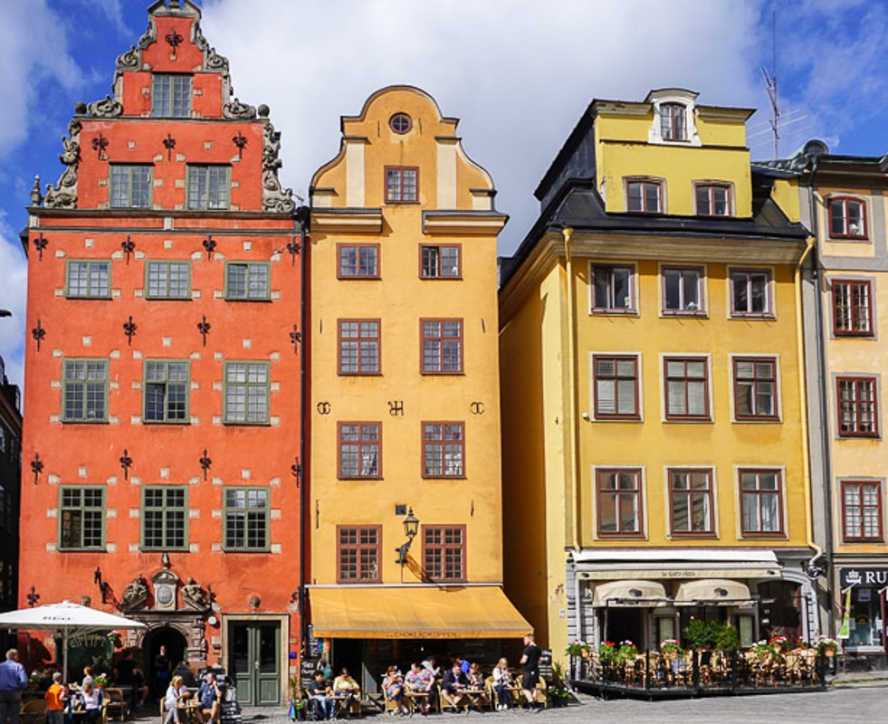 Stockholm square with 3 colorful buildings, orange and yellow