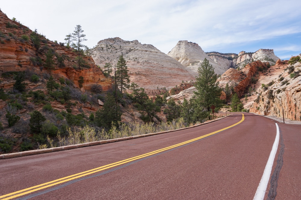 road with mountains leading into Zion National Park in Utah