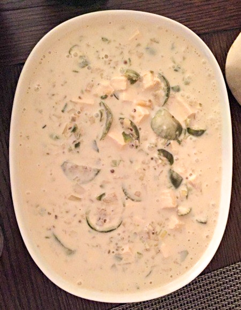 cooking dish of green curry (that came out white) with vegetables in it