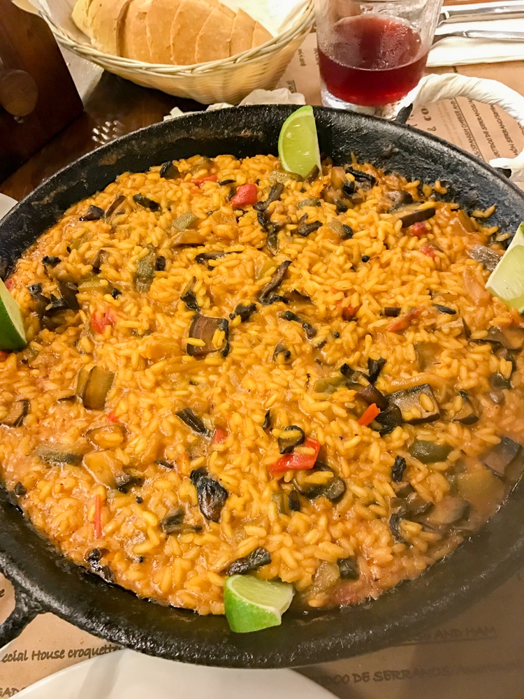 close up of paella in a pan on a table in a restaurant in Playa del Carmen Mexico