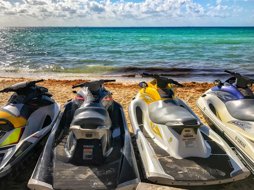 jet skis lined up on the beach in Playa del Carmen Mexico