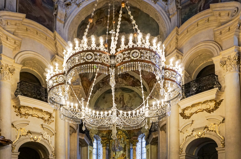 Up close of a candle chandelier at St. Nicholas Church in Prague Czech Republic