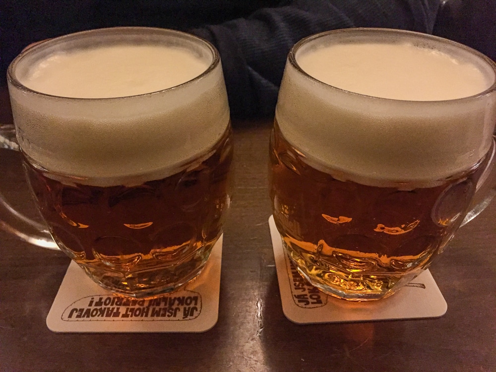 close up of 2 mugs of beer in Prague Czech Republic