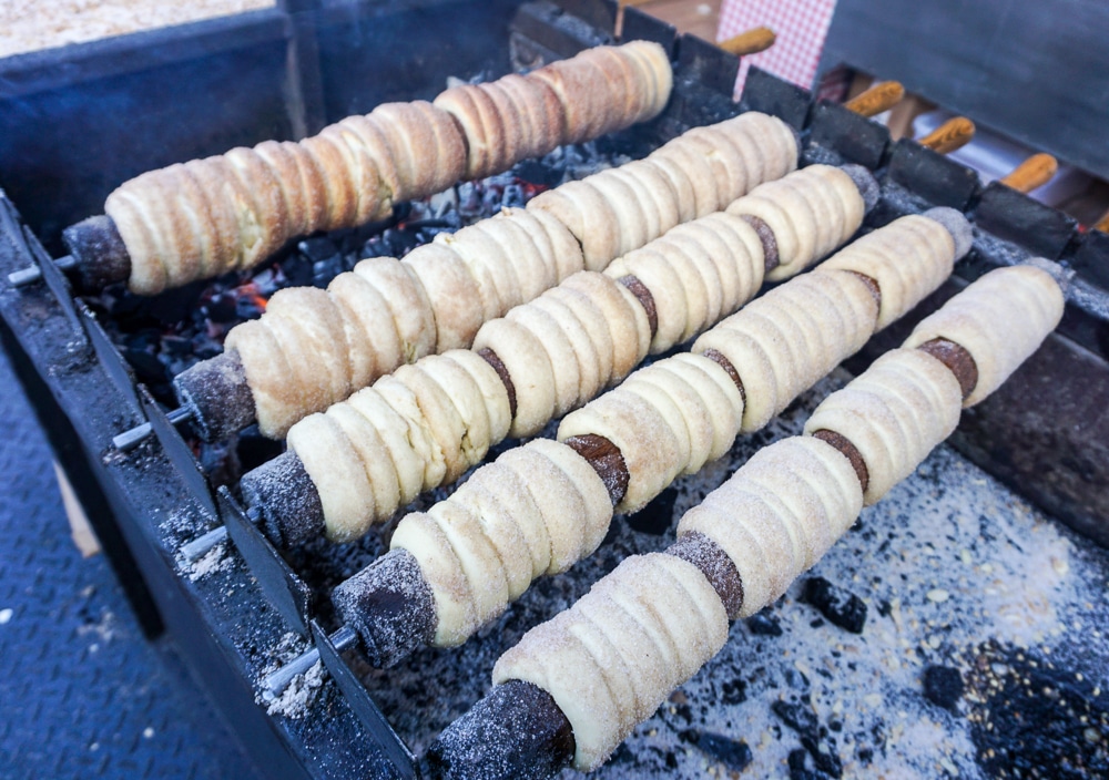 trdelnik rolls cooking on a spit over a barbecue in Prague Czech Republic