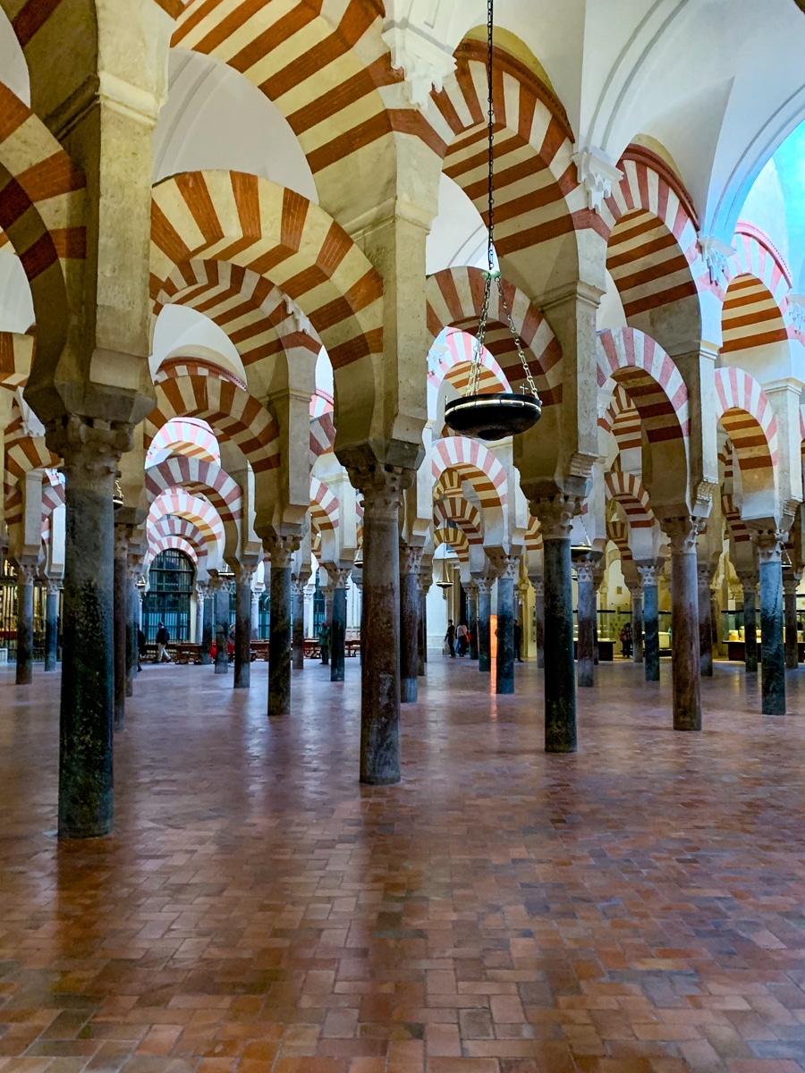 red and white striped arches at the Mezquita in Cordoba Spain